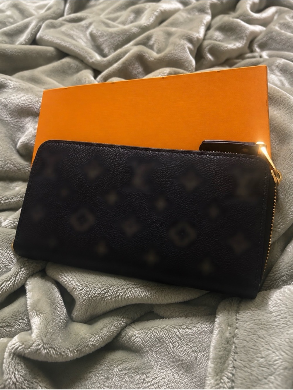 Elegant Black Zip-Around Wallet with Subtle Monogram Texture